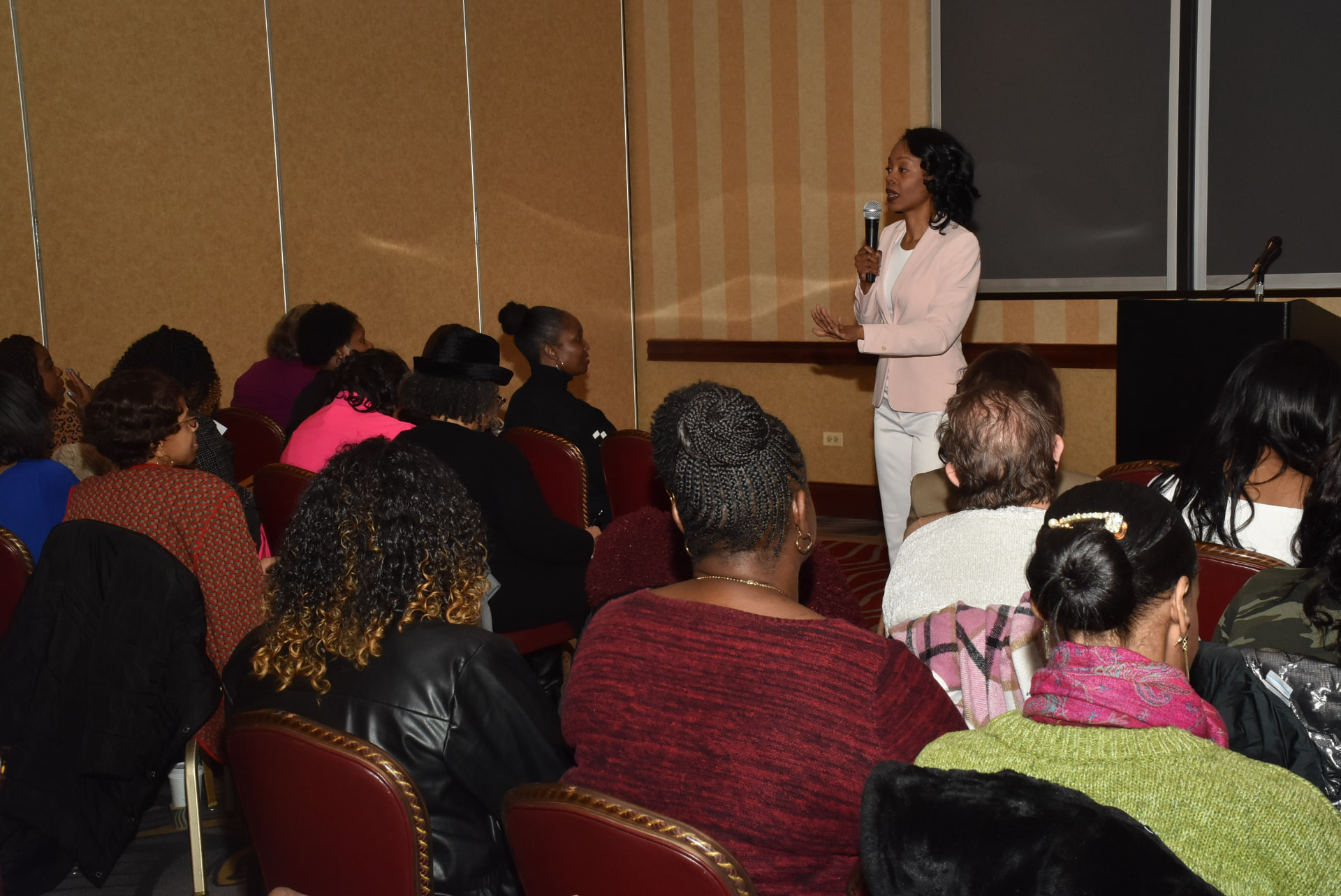 Rev. Jocelyn speaking to a room of women